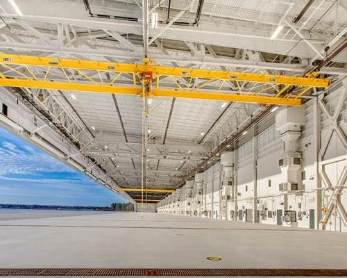 All-white interior of MV-22 Hangar brightly lit with natural and fluorescent light