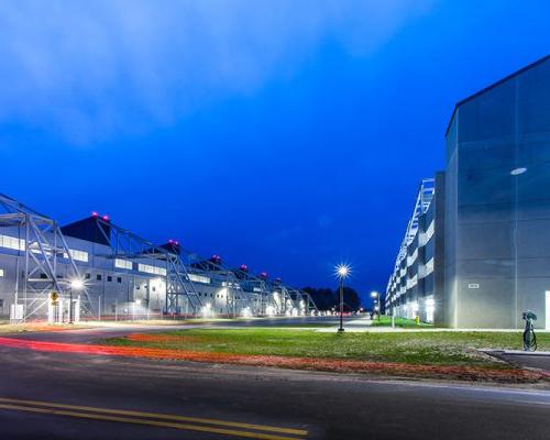 Nighttime exterior photo of MV-22 Hangar and Parking Garage